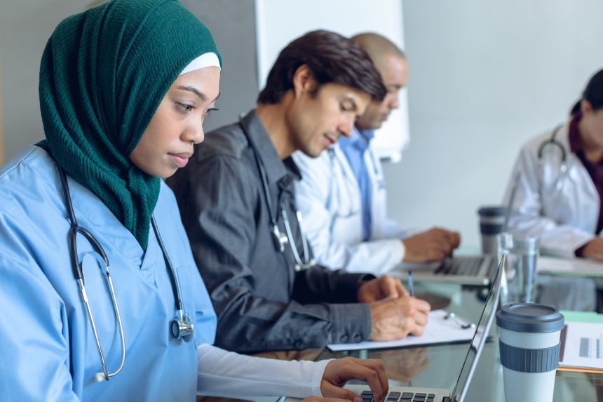 A diverse team of doctors. In the UK, there is a lack of ethnic inclusion in many clinical settings.