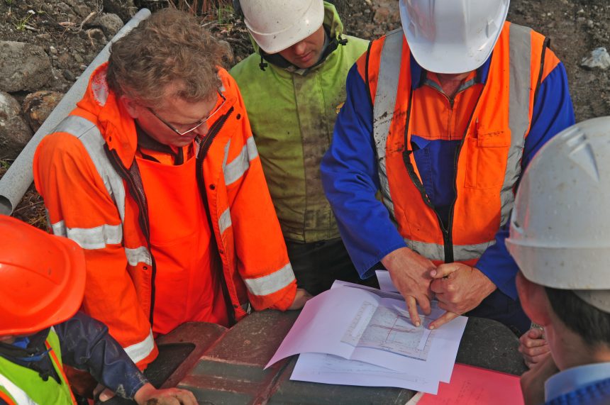 Geologists in the field discuss the results of a seismic reflection survey. A Level Geography could lead to a career in geology.