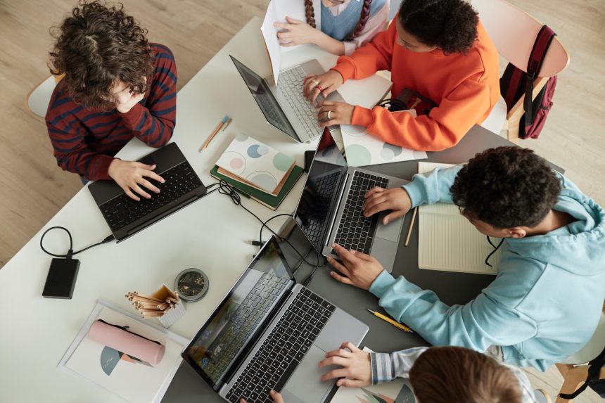 Group of A Level Computer Science students coding.