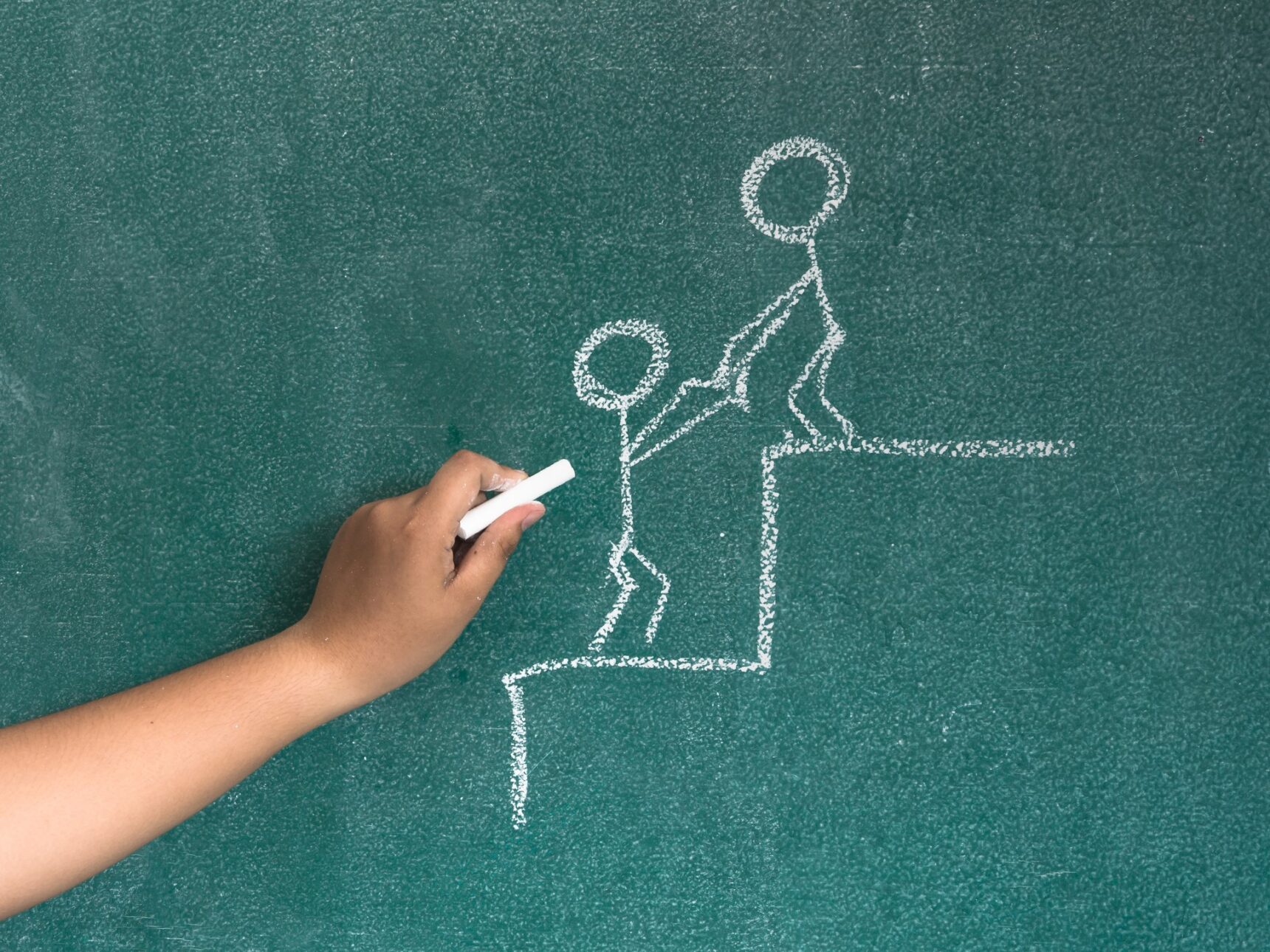 Chalkboard drawing of tutor helping student climb stairs step-by-step.